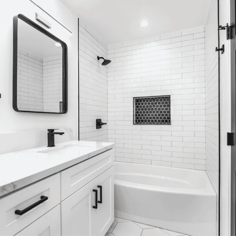 Modern bathroom design in Kirkland featuring a natural light oak vanity and stone tiles, reflecting a Pacific Northwest aesthetic with natural materials.