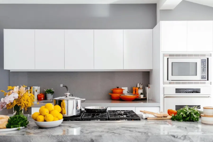 Shoreline General Contractor & Home Remodeling | CHCRemodel 2 White kitchen cabinets, integrated appliances and a stone countertop