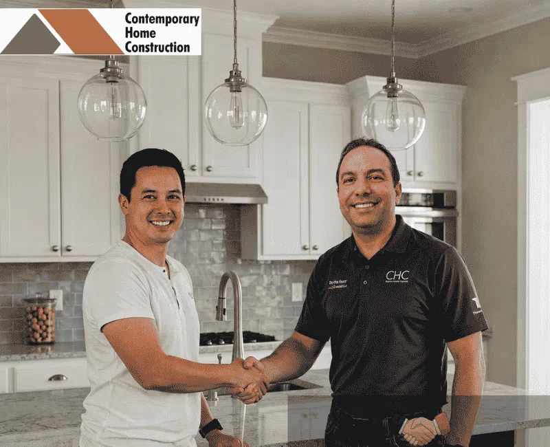 CHC Remodeling Kirkland, WA team member with homeowner in completed kitchen remodeling project