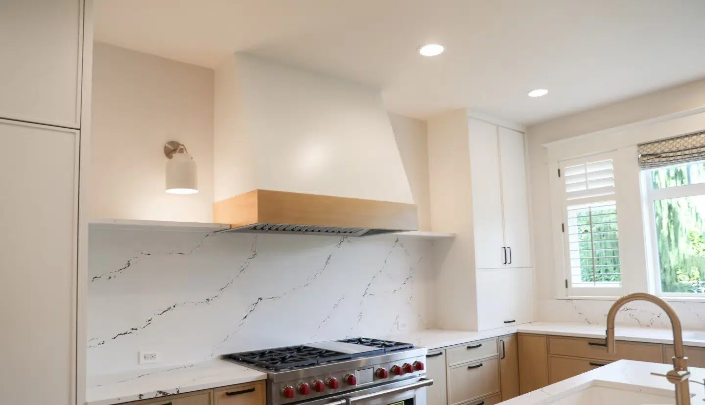 Shoreline General Contractor & Home Remodeling | CHCRemodel 3 Custom range hood, white backsplash and wood kitchen cabinets