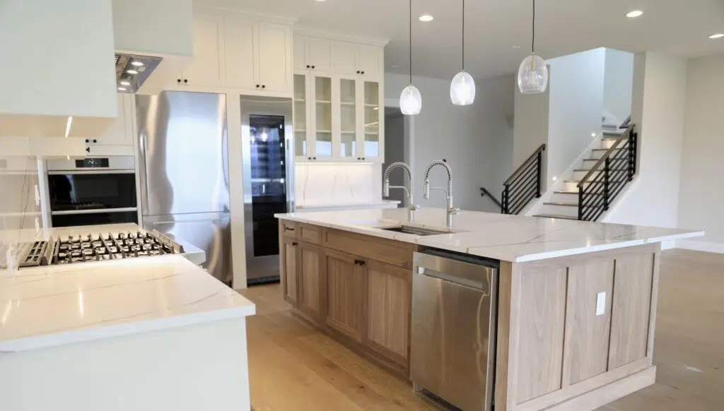 Open-concept kitchen with custom wood island and white cabinets