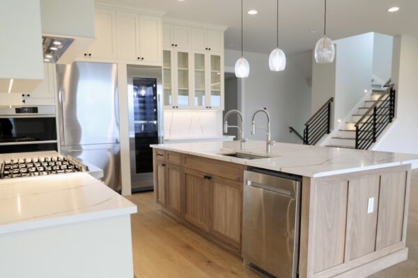 Open-Concept Kitchen with Custom Island Open-concept kitchen with custom wood island and white cabinets