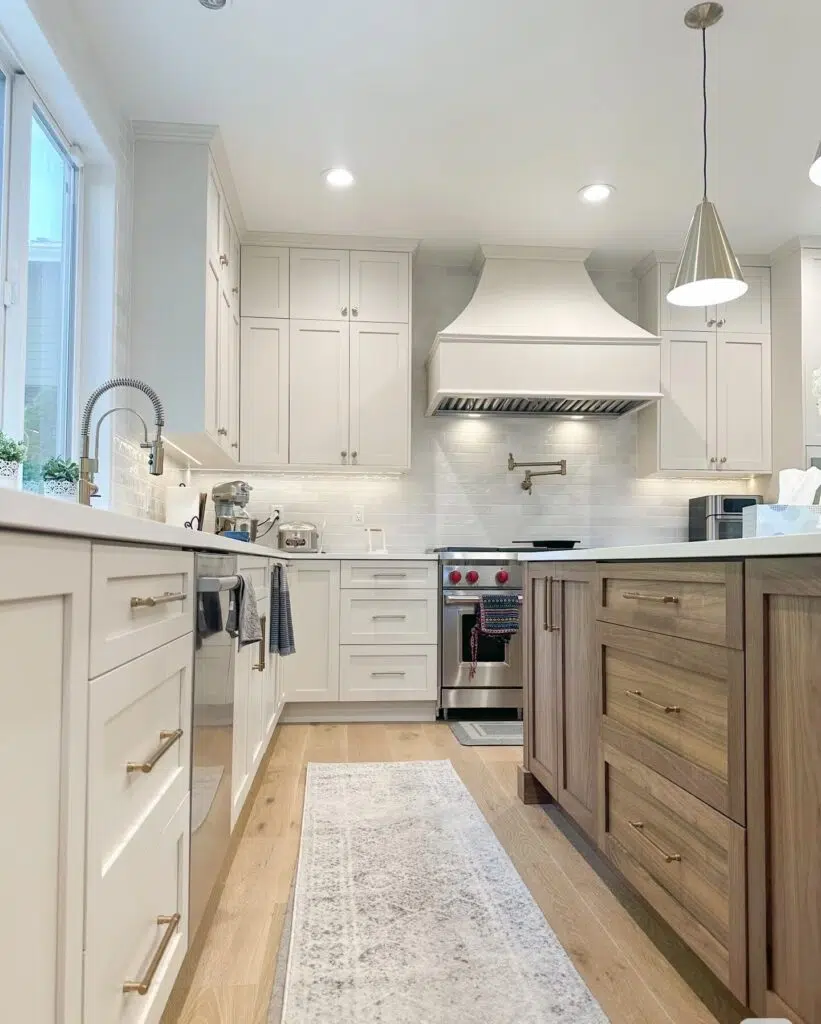White kitchen remodel with wood island cabinetry